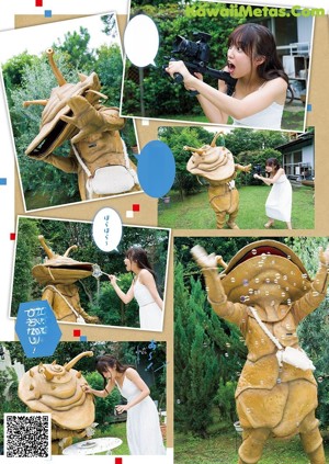 A woman sitting on the ground next to a giant alien.