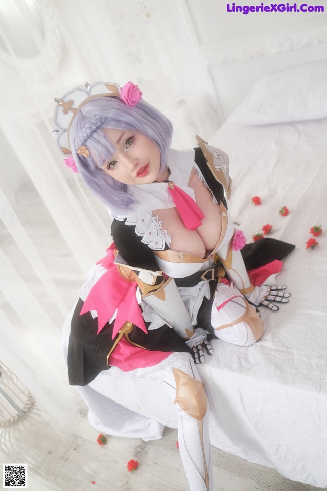 A woman in a cosplay sitting on a bed.