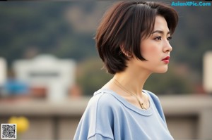 A woman in a red jacket and black lingerie leaning against a fence.