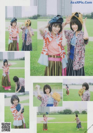 A group of young women standing on top of a lush green field.